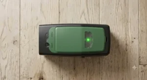 Top view of an electric mouse trap displaying a green LED indicator light showing a catch