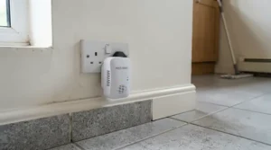 An electronic mouse deterrent for home active in a busy utility room with washing machines